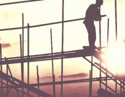 General Liability Insurance - construction workers on building frame