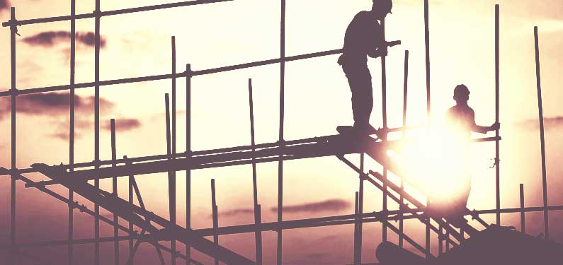General Liability Insurance - construction workers on building frame