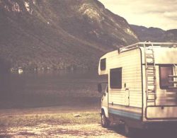 RV Insurance - vintage photo of rv by the lake