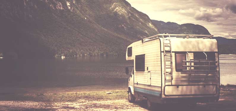 RV Insurance - vintage photo of rv by the lake