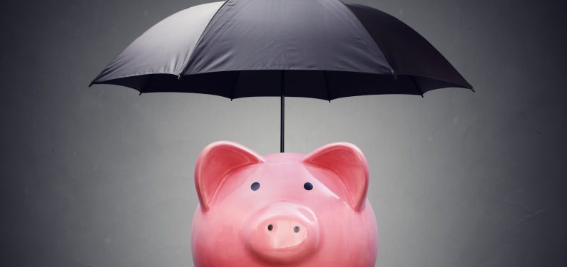 piggy bank with black umbrella over it