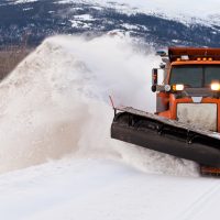 snow plow insurance - snow plow clearing after blizzard