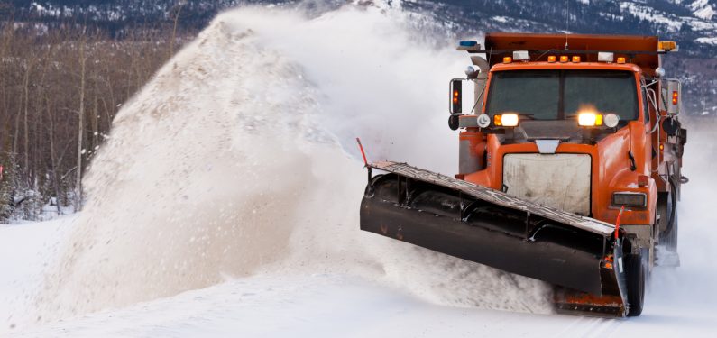 snow plow insurance - snow plow clearing after blizzard