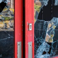 business with broken glass doors