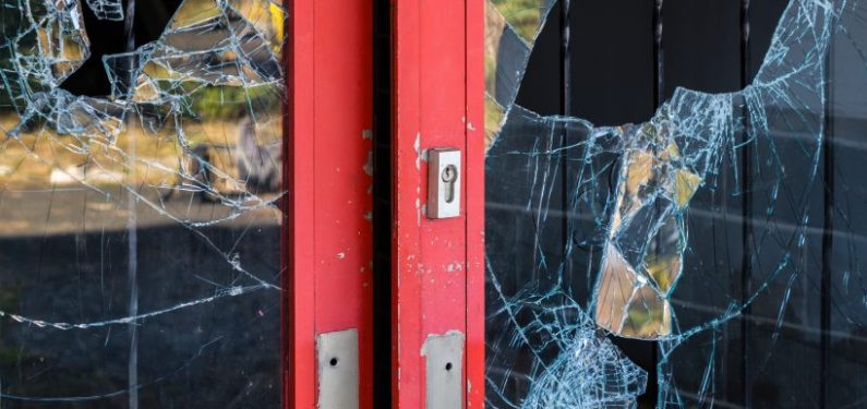 business with broken glass doors