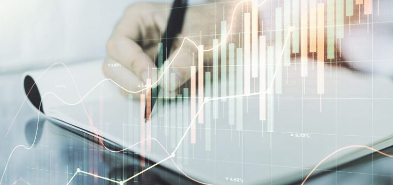 abstract financial graph with hand writing in notebook