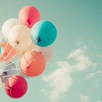 bunch of balloons against a sky background