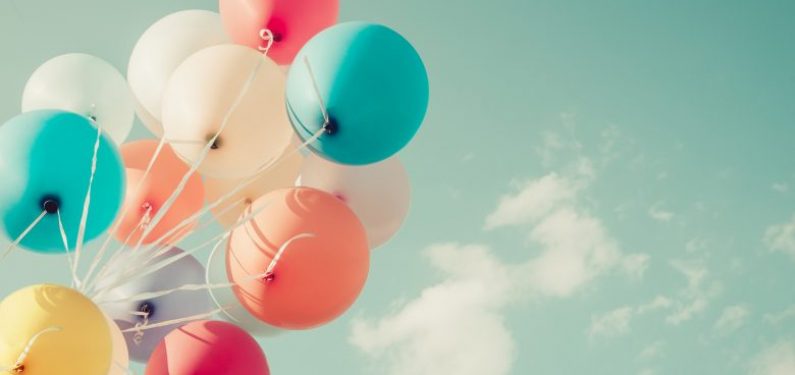 bunch of balloons against a sky background