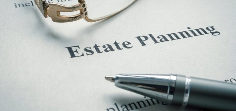 estate planning documents with a pair of glasses