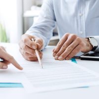 two people reviewing contract
