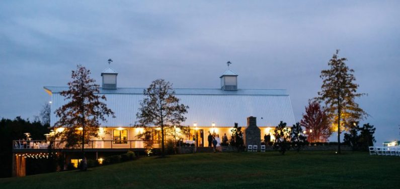view of barn wedding from a distance at night